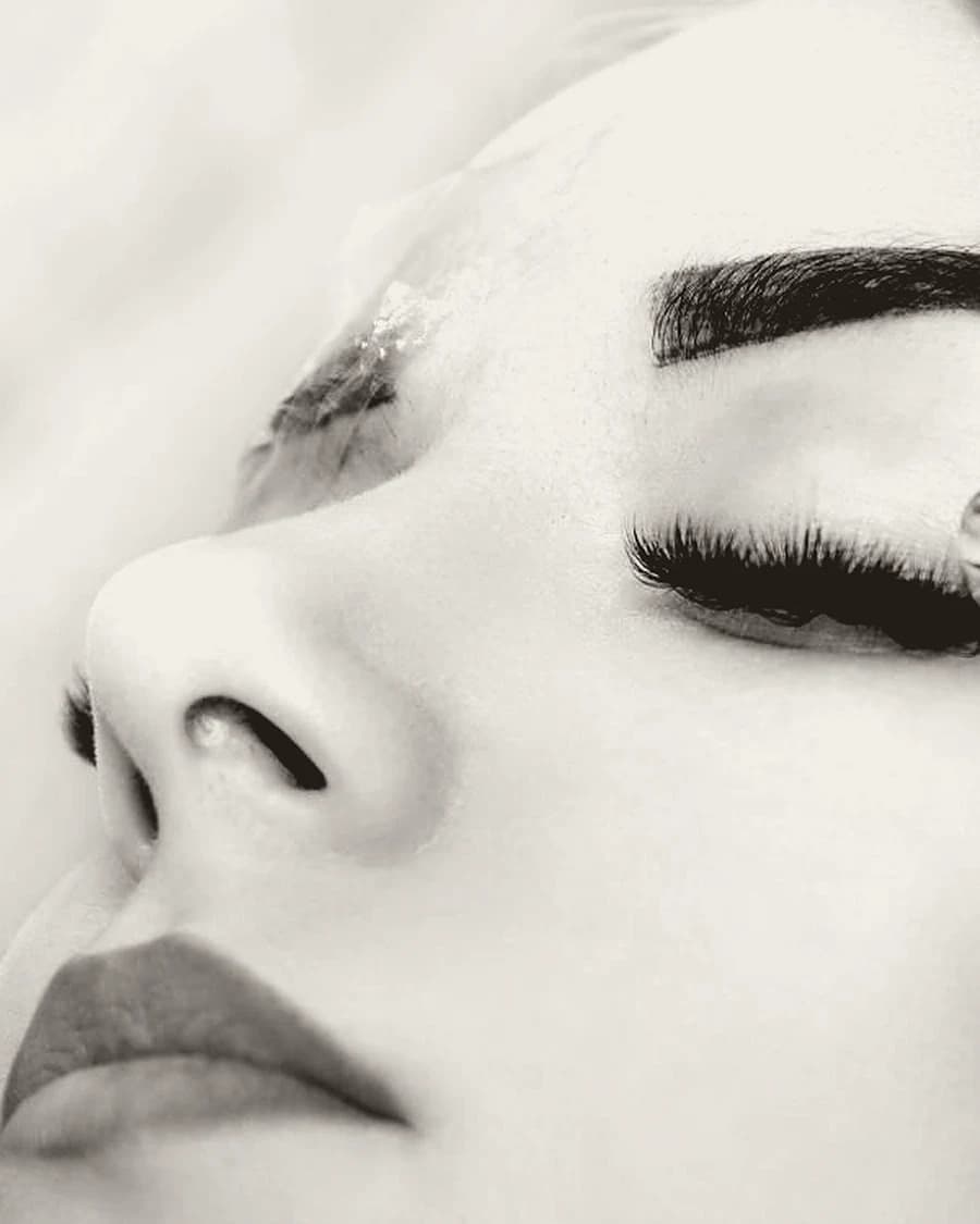 A close study of a brow and lashes in profile